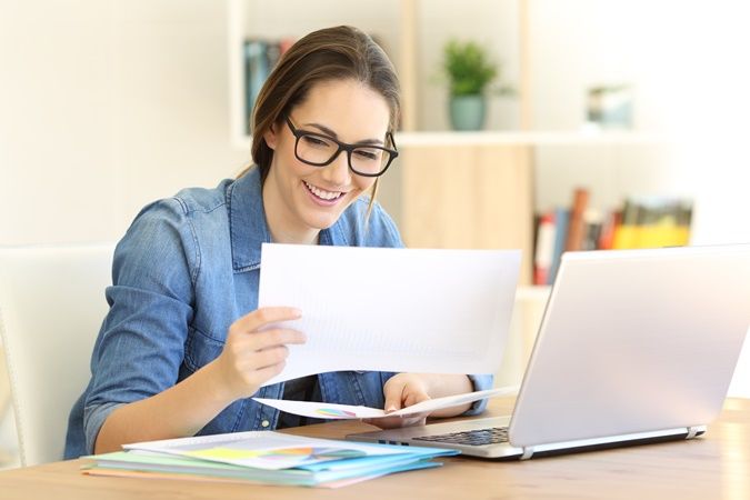 Stock photo of woman looking at a page